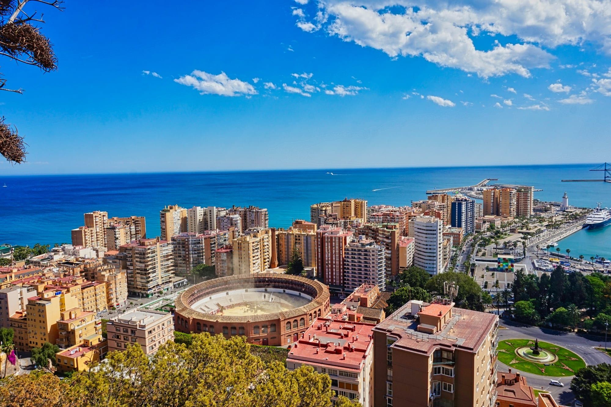 Málaga seen from above, with the bullring, the port and the sea